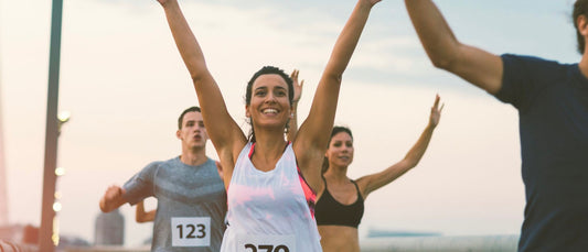 Woman Celebrating Marathon Finish Line
