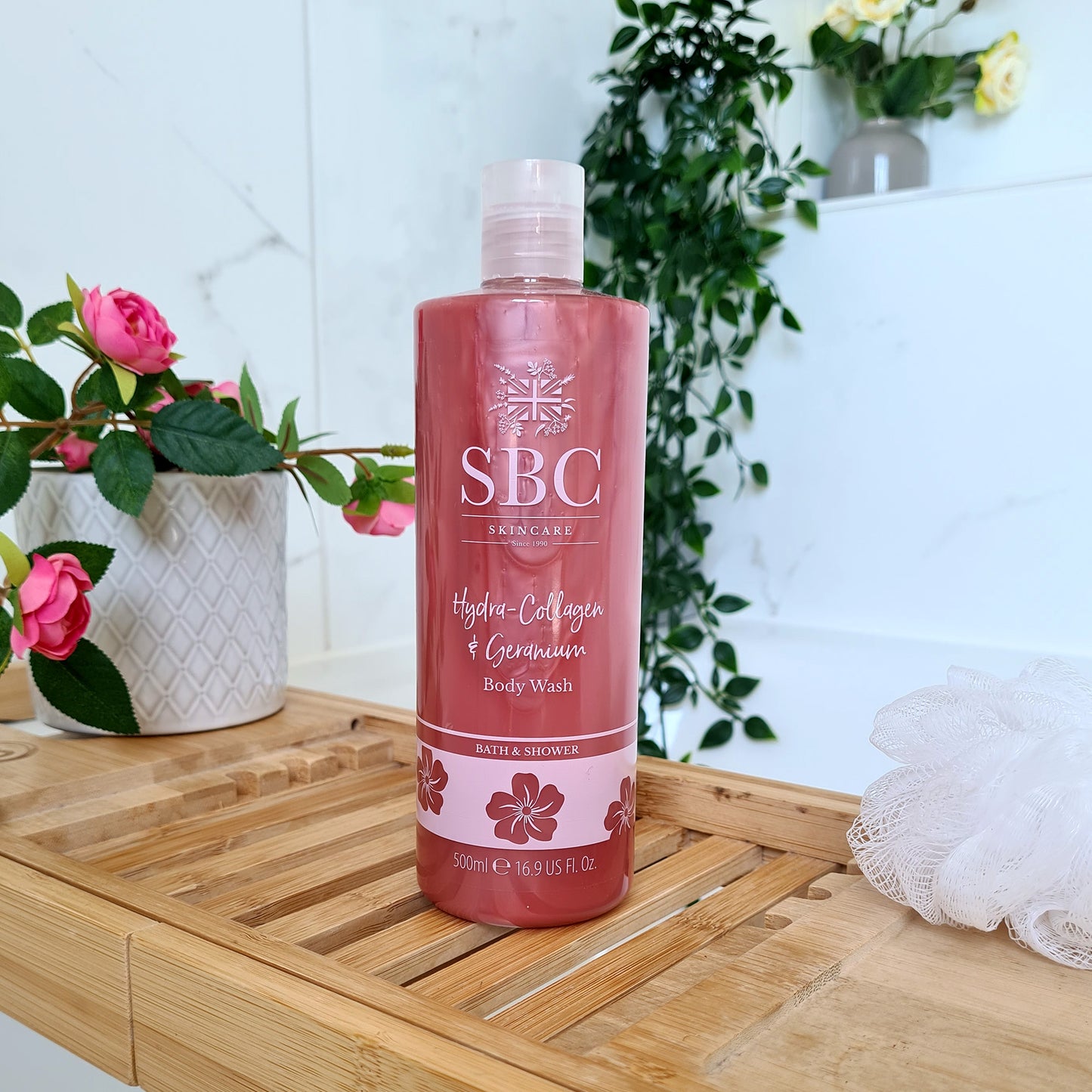 Hydra-Collagen & Geranium Body wash on a wooden bath Caddy