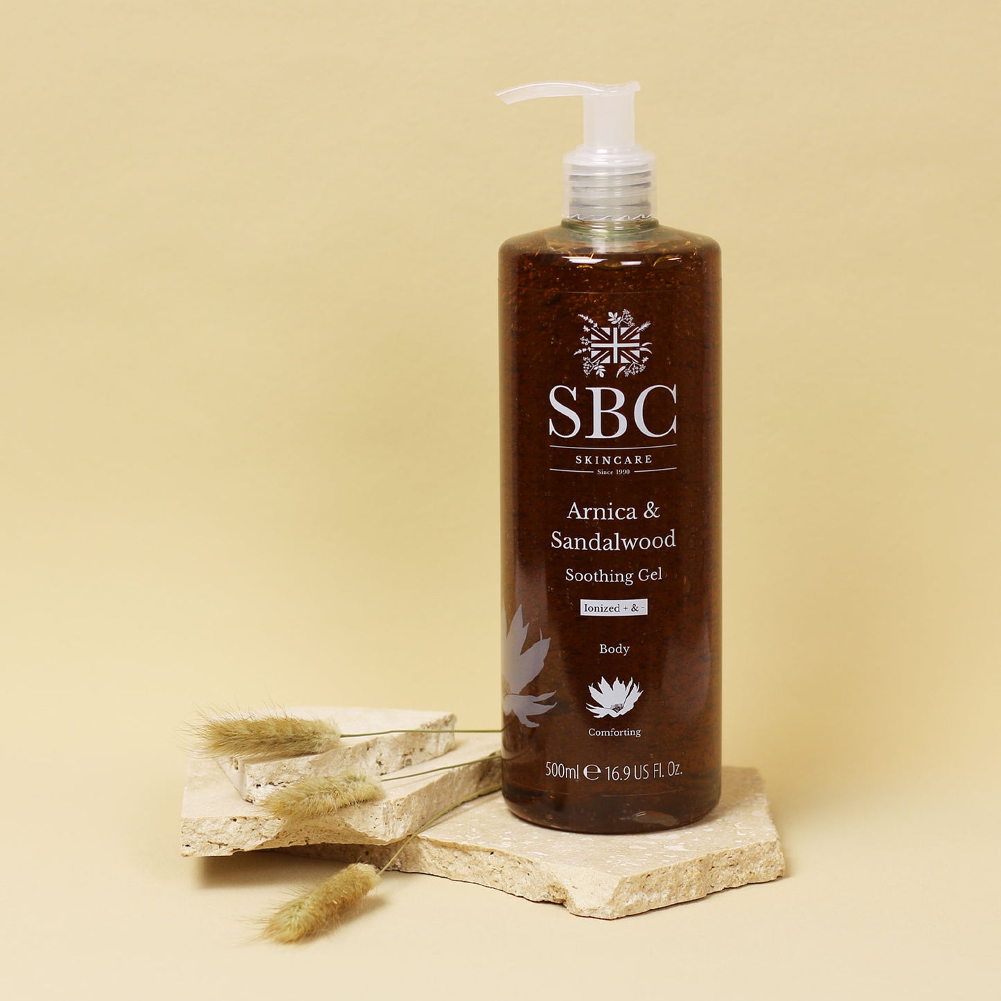 Arnica & Sandalwood Soothing Gel on a cream background with dried flowers