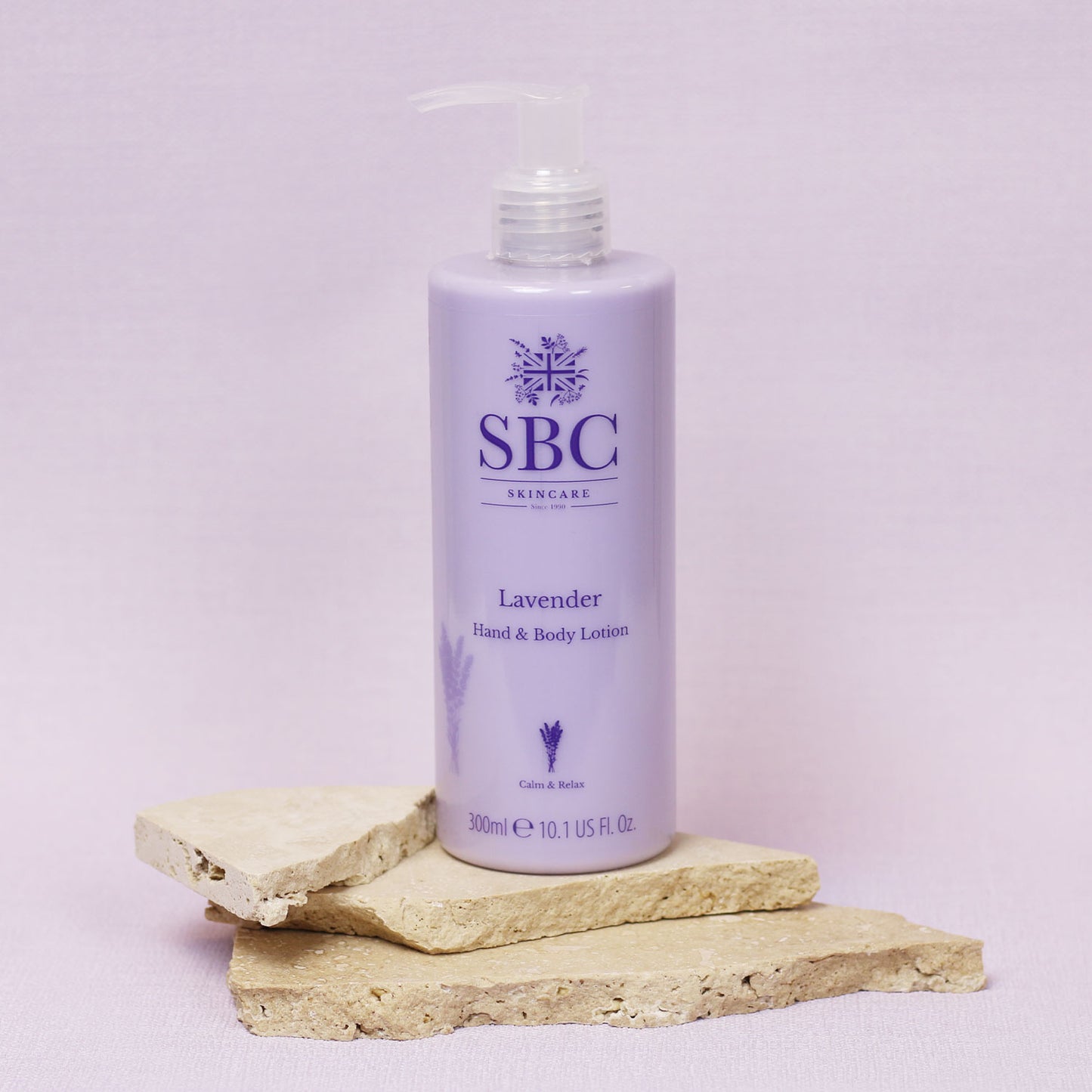 Lavender Hand & Body Lotion Sand Stone with a pale purple background