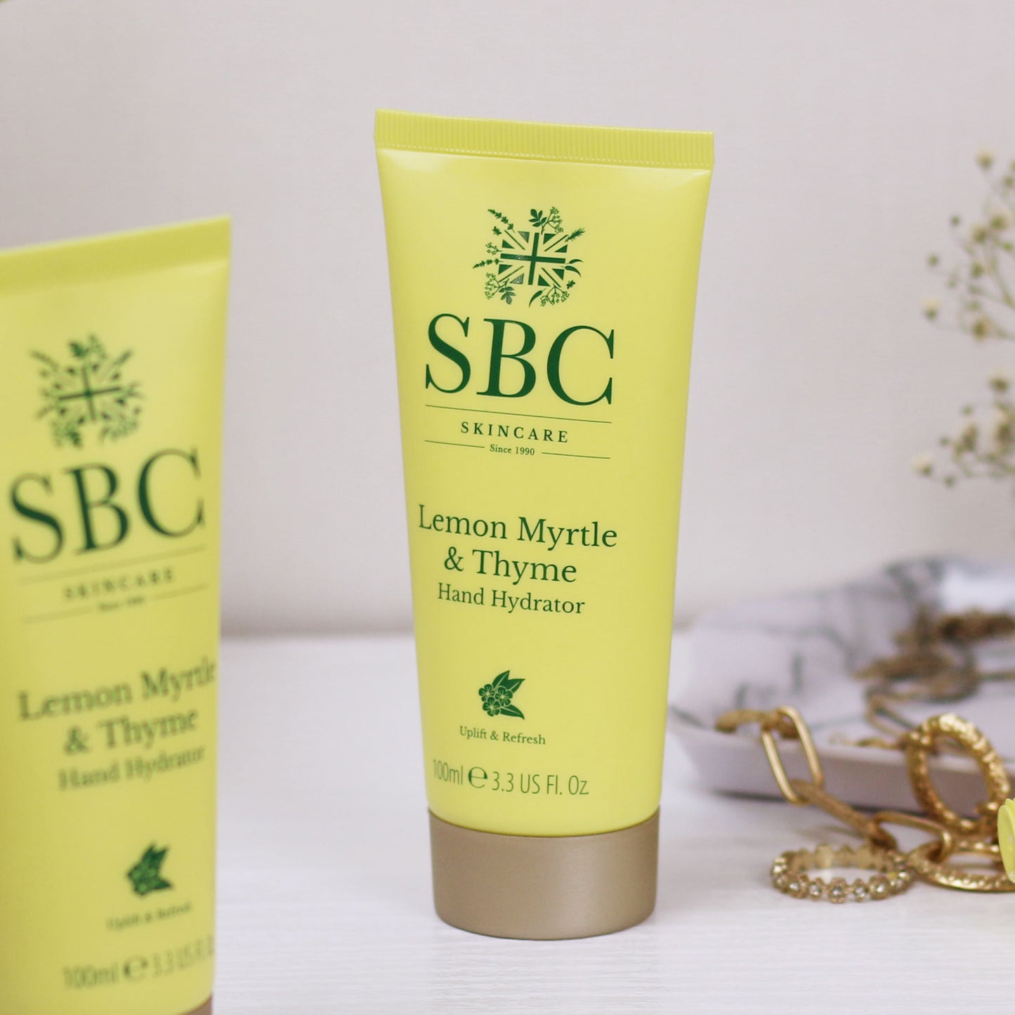 Lemon Myrtle & Thyme Hand Hydrator on a dressing table with jewellery