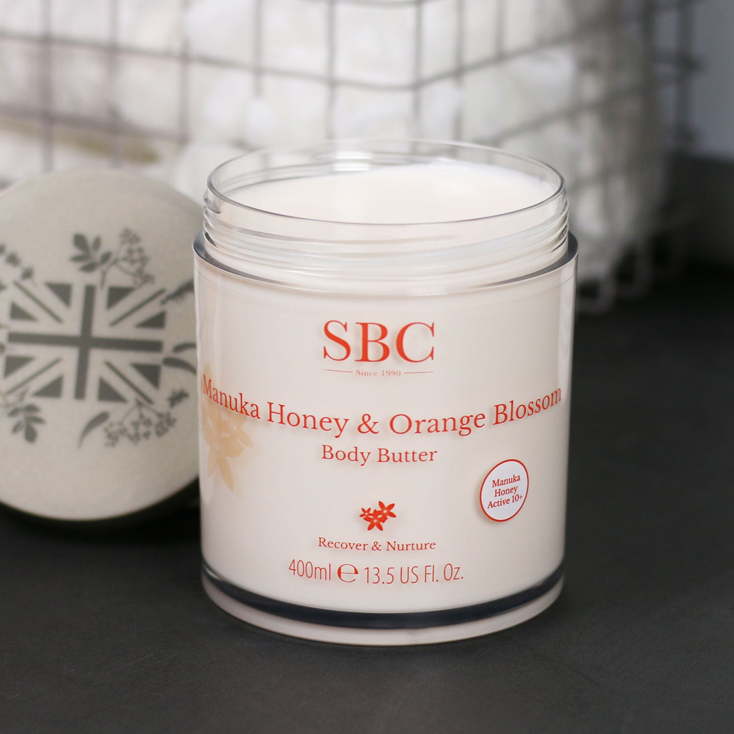 Manuka Honey & Orange Blossom Body Butter on a slate counter top