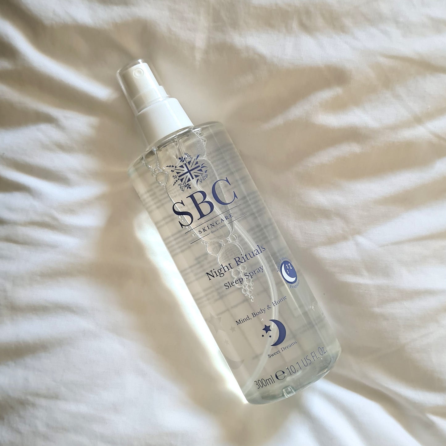 Night Rituals Sleep Spray 300ml on a white pillow