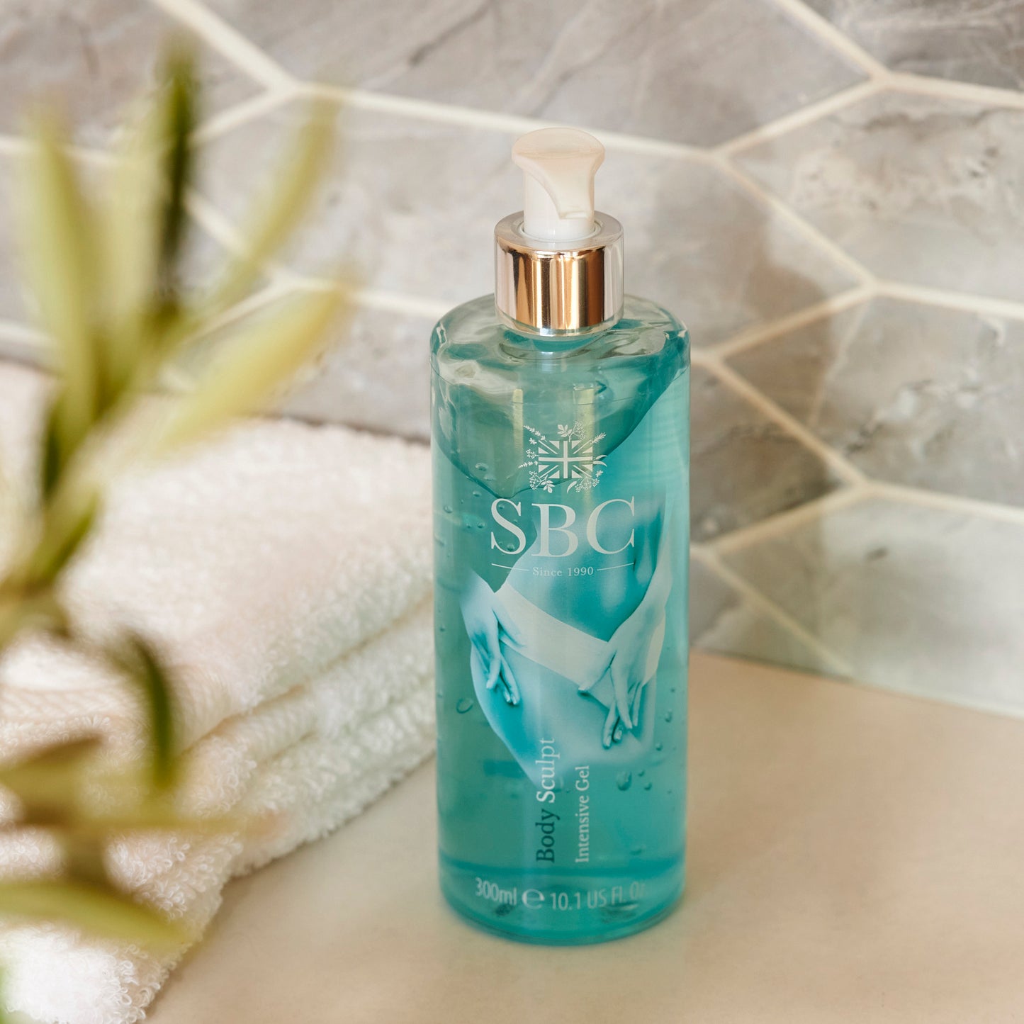 Body Sculpt Intensive Body Gel 300ml on on a stone bathroom counter with towels
