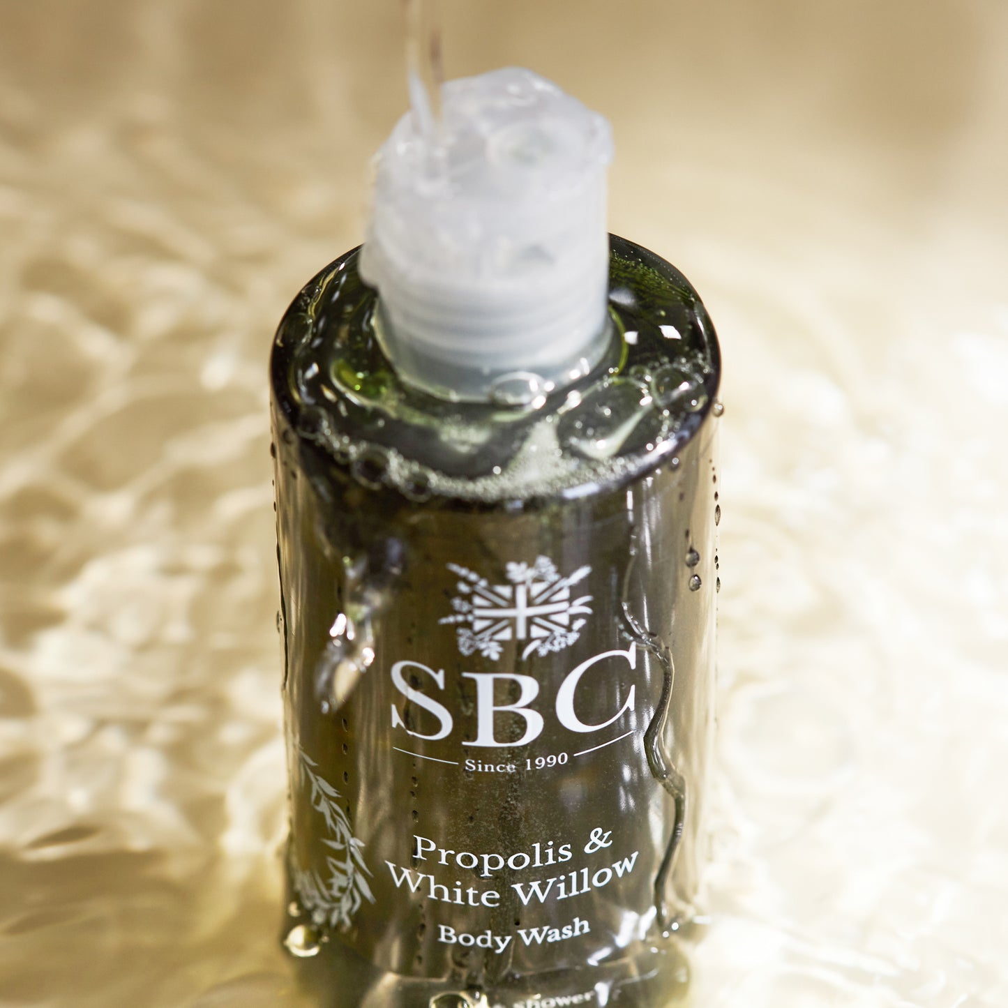 Propolis & White Willow Body Wash having water poured on it from above