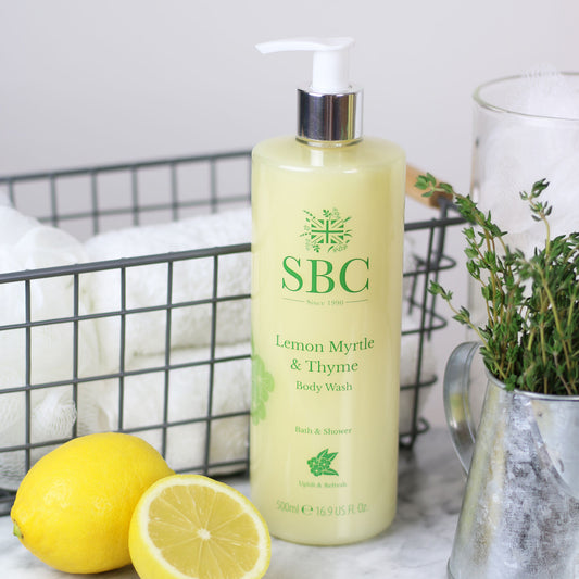 500ml Lemon Myrtle & Thyme Body Wash with lemon wedges and a container of thyme 